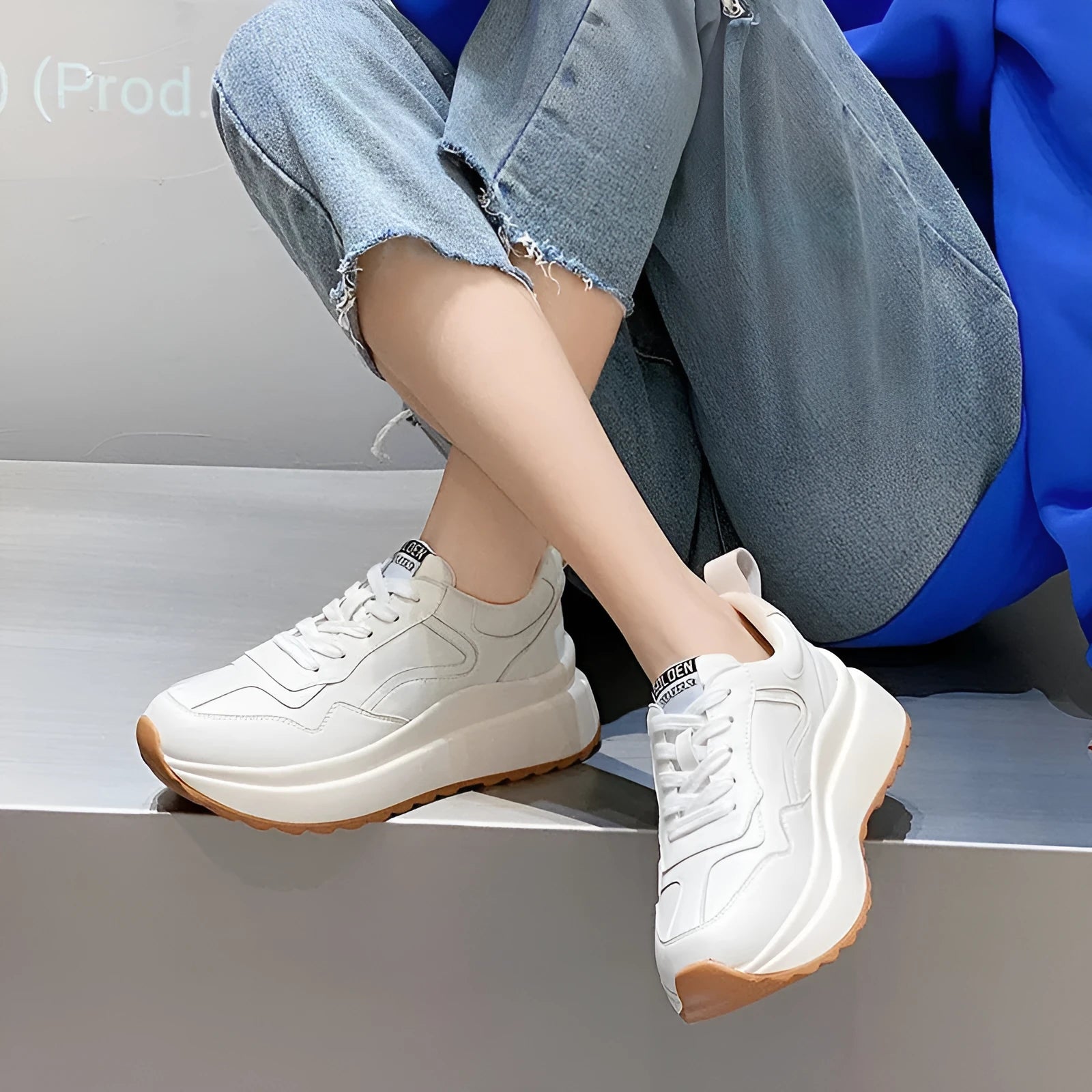 Beige women's low-top lace-up casual shoes with cowhide leather upper and cross strap detail.