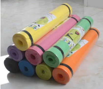 Red EVA fitness yoga mat with 6mm thickness on a wooden floor.