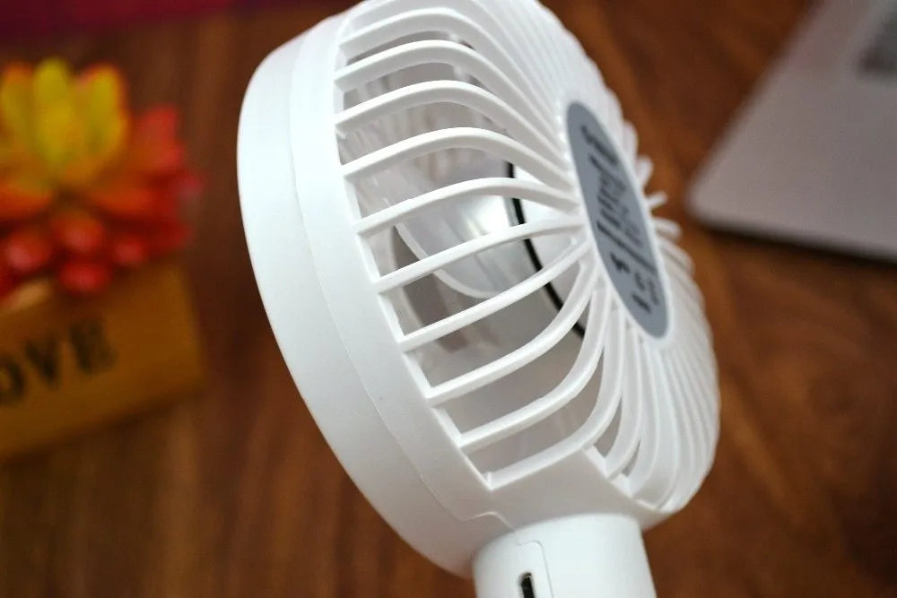 White ORICO FH1 USB rechargeable portable fan with fine line details on desktop
