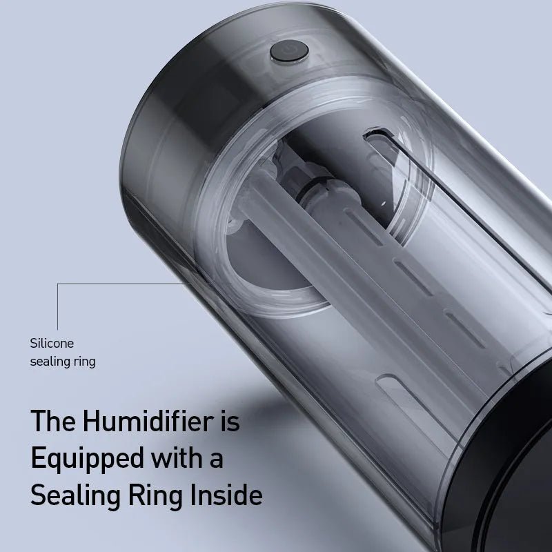 Black aluminium USB car humidifier and essential oil diffuser on a car dashboard.