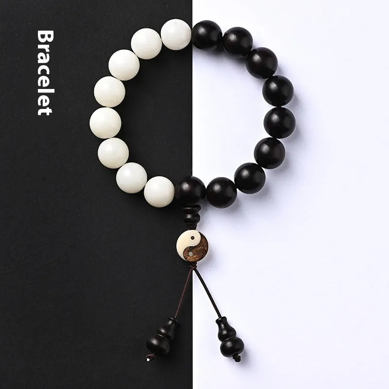 Handmade bodhi seed bracelet with 11mm mixed yuan beads including white palm seeds and carved blackwood elements