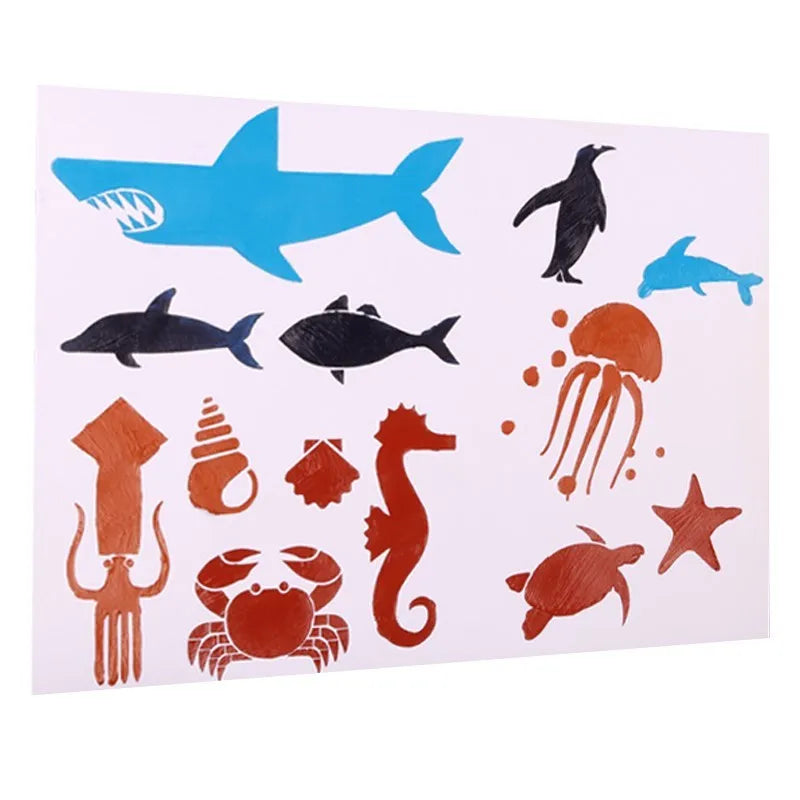 White plastic drawing stencil template for decorative patterns on a craft table.