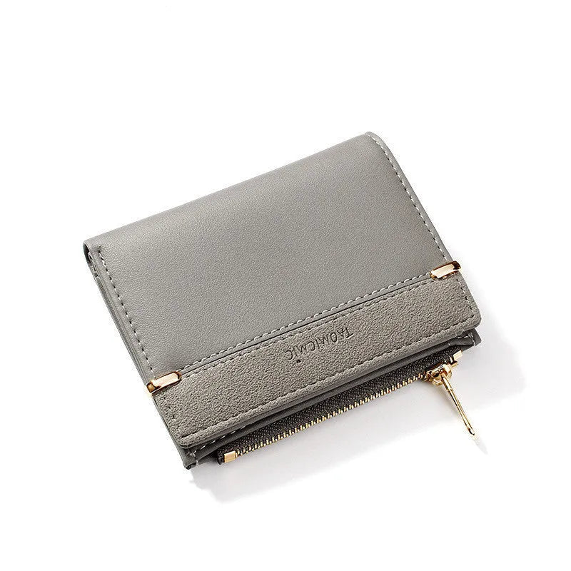 Ladies' black zip-around PU leather wallet open showing multiple card slots and internal compartments.