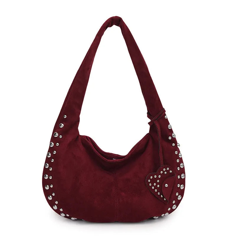 Soft plush casual tote handbag in a retro style, shown in a strapless underarm carry position.