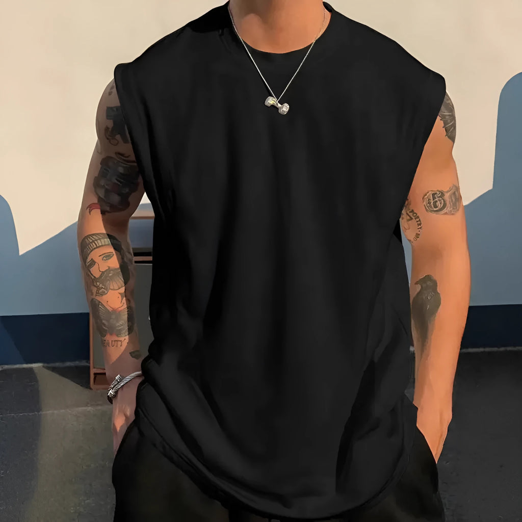 Men's loose fit solid colour cotton sleeveless t-shirt on a hanger, shown in apricot.