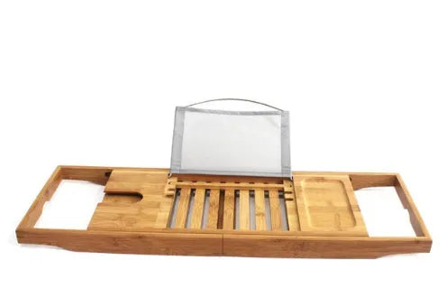 A bamboo bathtub frame storage organiser with a single shelf, shown on a bathroom desktop next to a tub.