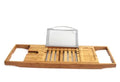 A bamboo bathtub frame storage organiser with a single shelf, shown on a bathroom desktop next to a tub.