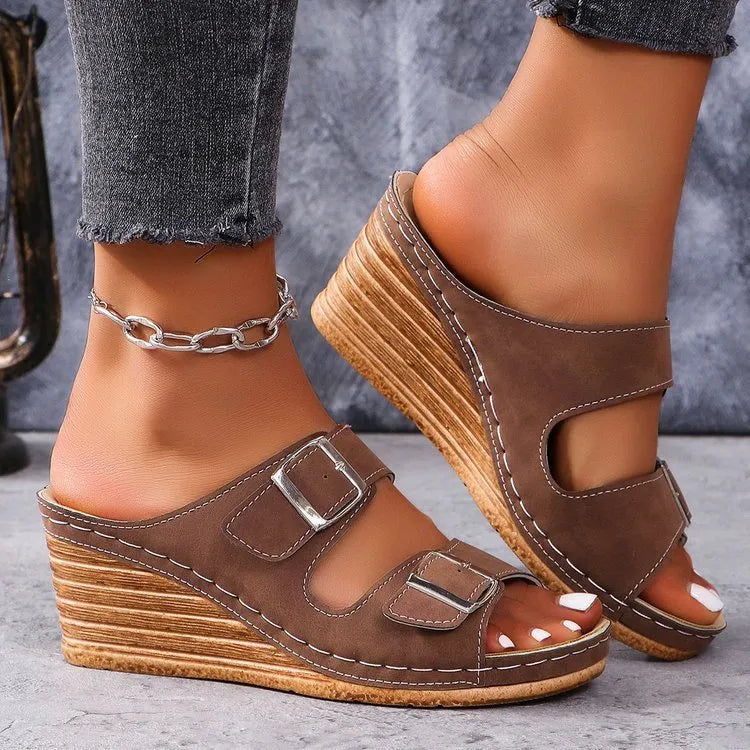 Women's creamy-white wedge beach slippers with an adjustable belt buckle strap and rubber sole
