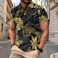 Man wearing a gold short sleeve shirt with a tropical leaf pattern print