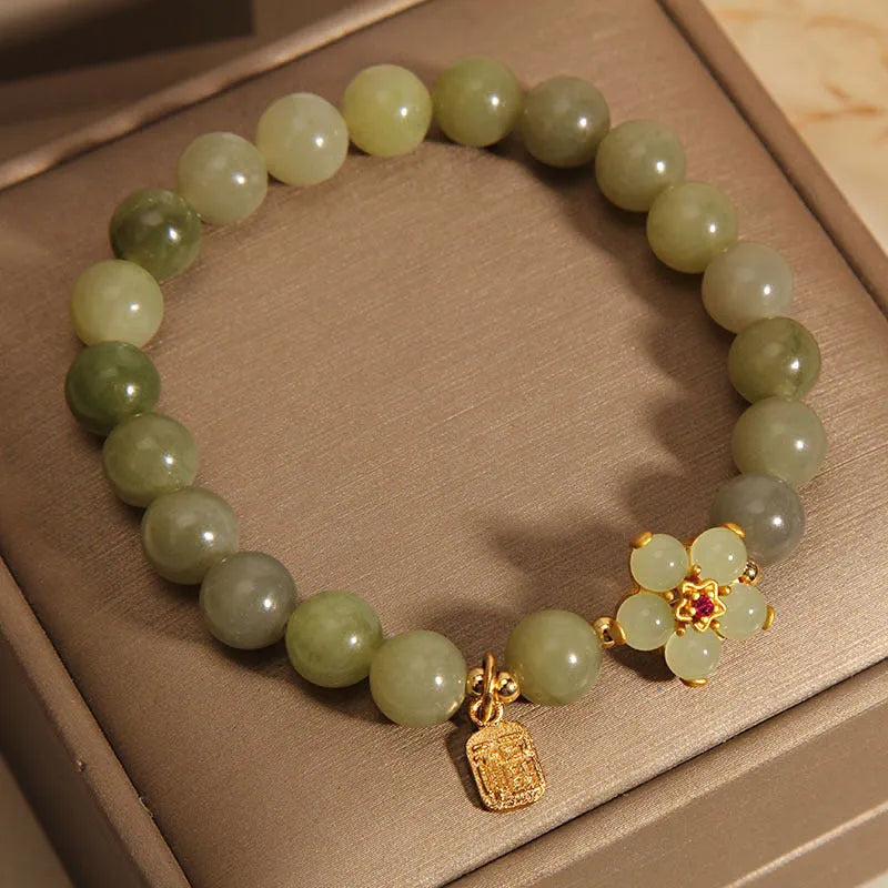A grey jade coloured alloy bracelet for women in a casual style.
