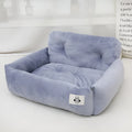 Grey and blue plaid car-mounted stain-resistant dog travel nest in two sizes.