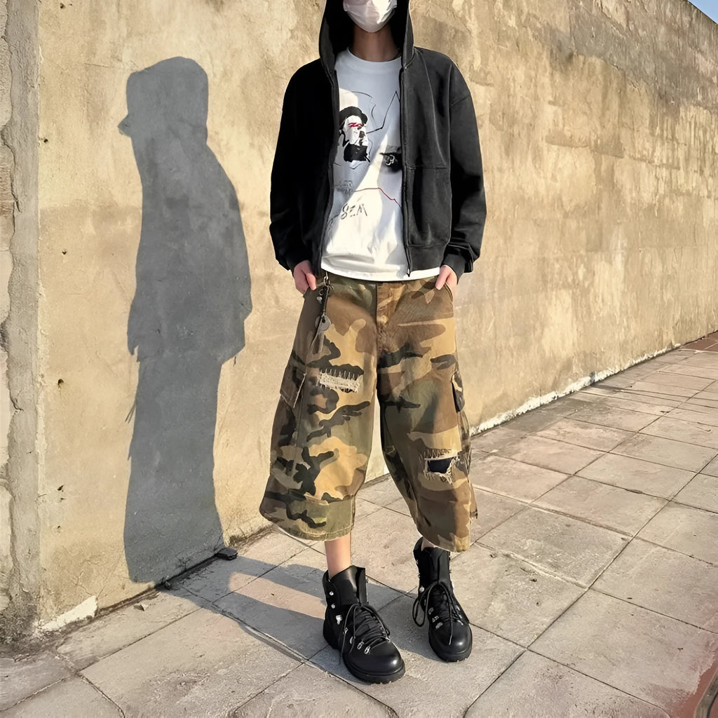 Men's camouflage coloured jeans with patchwork and ripped details, cropped length, straight loose fit.