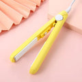 Mini hair straightener and curler for bangs styling in a choice of colours with a storage box.