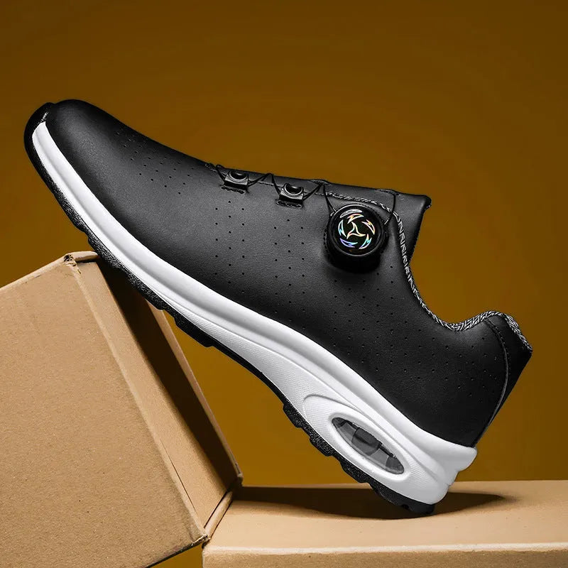 Low top tennis shoes in black with mesh upper, cross shoulder straps, and composite sole