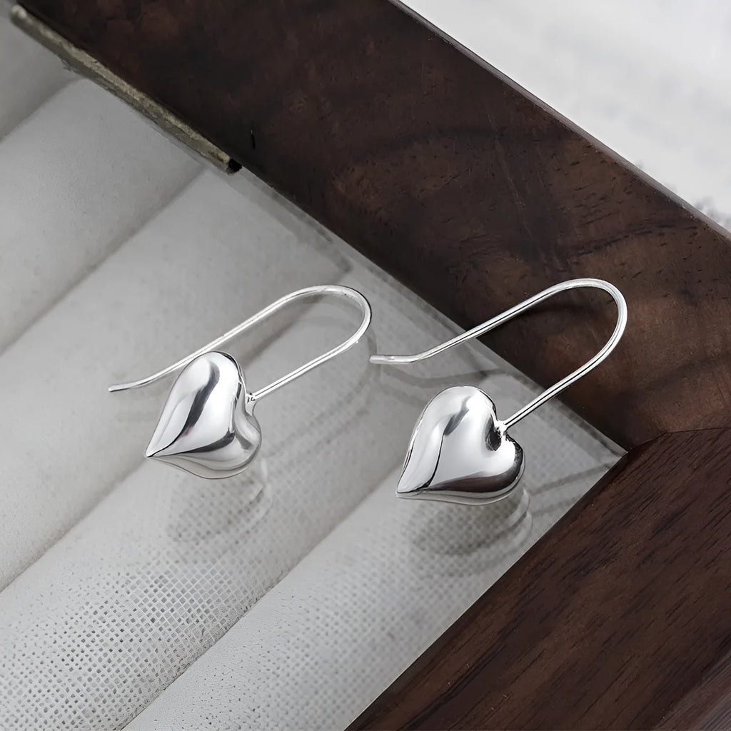 Korean style 3D glossy heart-shaped women's earrings with white gold colour finish