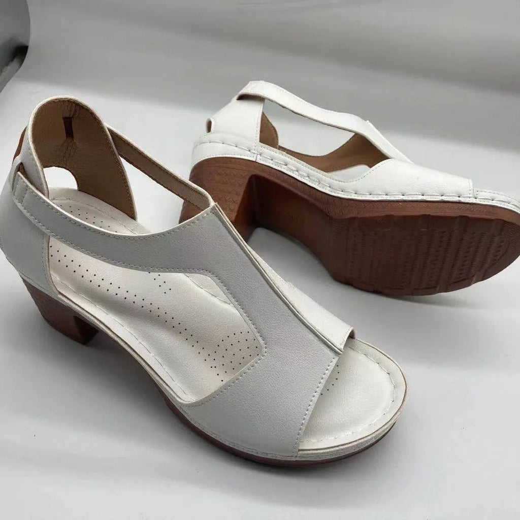 Women's plus size peep toe wedge sandals with Roman straps and a buckle in light brown.