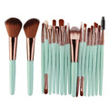 MAANGE 18-piece makeup brush set showing fan brushes and various cosmetic brush types.