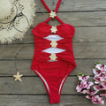 Women's solid colour one-piece swimsuit with hollow-out tube top and matching short skirt.