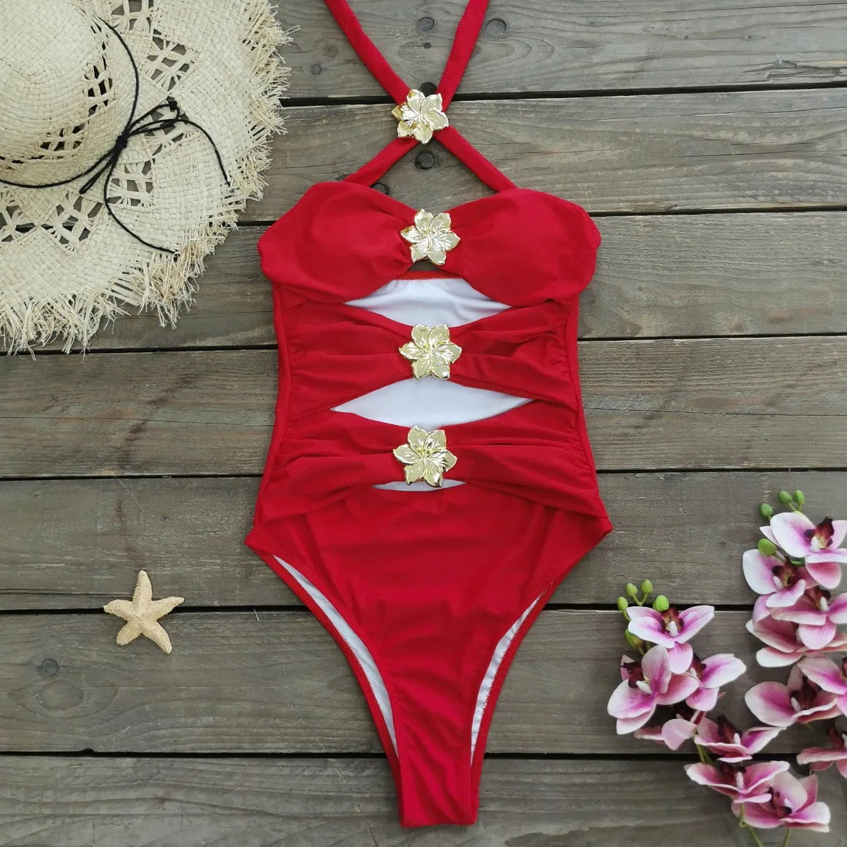 Women's solid colour one-piece swimsuit with hollow-out tube top and matching short skirt.