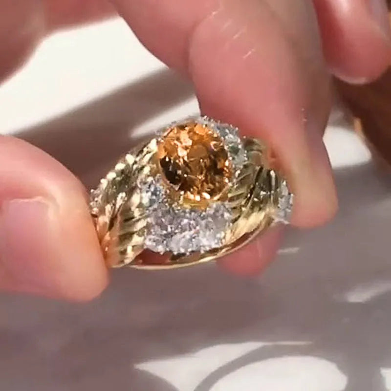 Gold-colour copper women's ring with embossed feather design and inlaid yellow zircon stone