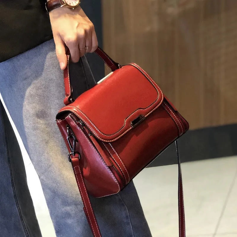 Women's genuine leather retro messenger bag in horizontal square shape with multiple interior compartments