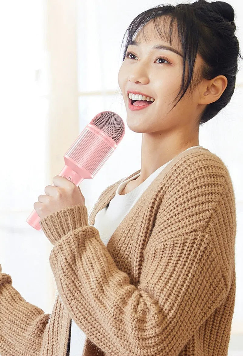 Bluetooth wireless karaoke microphone with integrated speaker in blue, green or pink colour options
