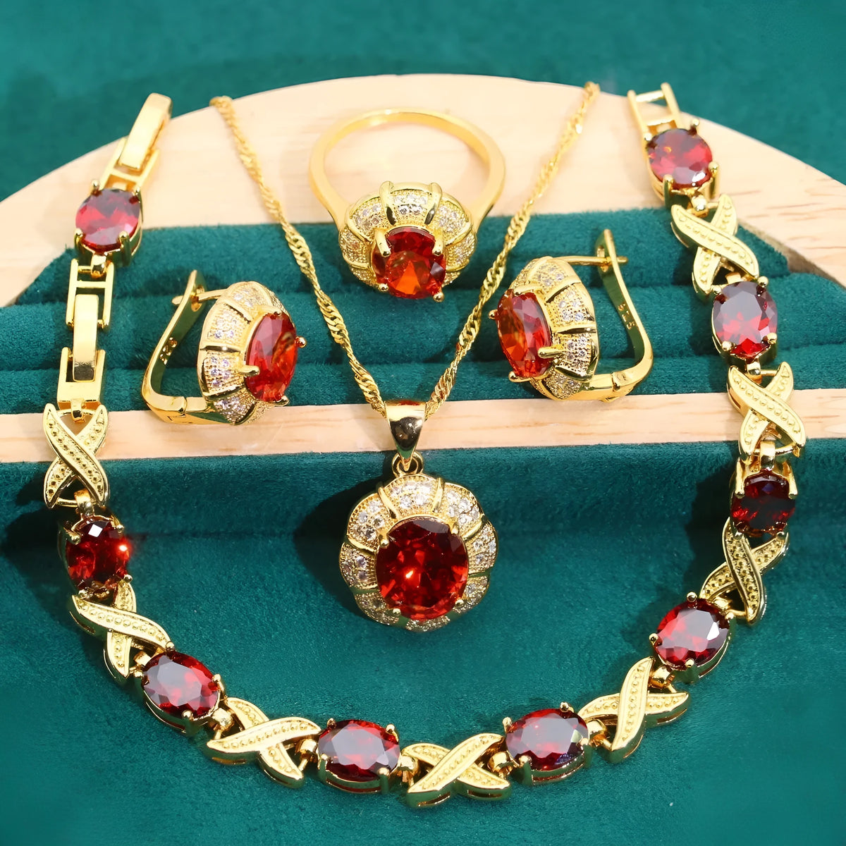 18k gold plated jewellery set with blue cubic zirconia stones showing necklace, earrings, ring, and bracelet
