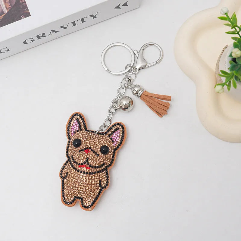 Cartoon dog design rhinestone keychain pendant on alloy base in caramel colour