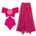 Women's one-piece swimsuit with hollow-out flower pattern and a matching skirt on a hanger.