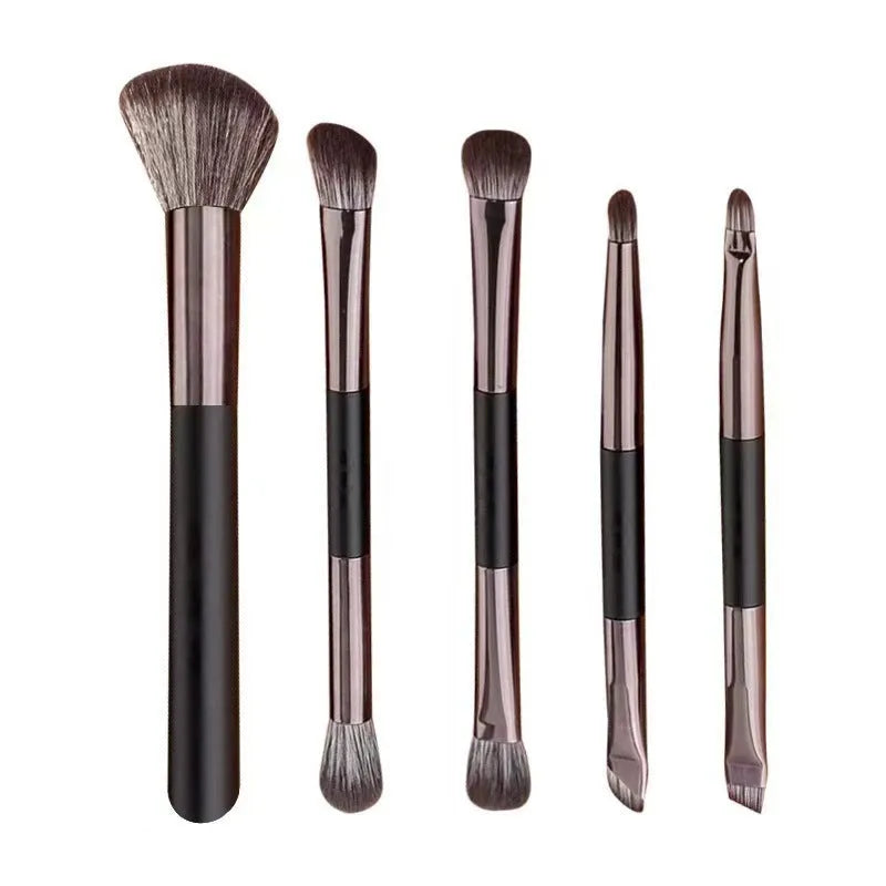 Makeup brush kit with built-in mirror showing silver or gold plastic handles and artificial fibre bristles