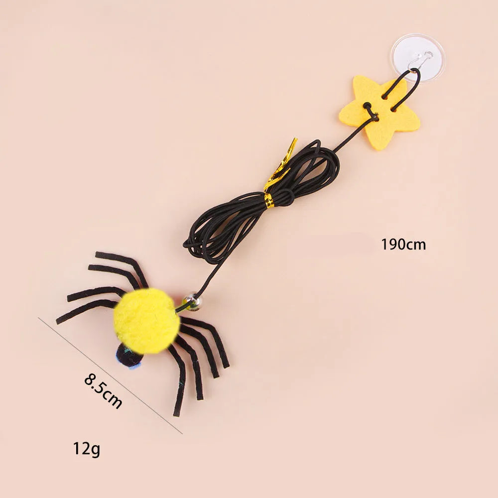 Hanging cat toy with feathers, bell and colourful spiders on elastic rope