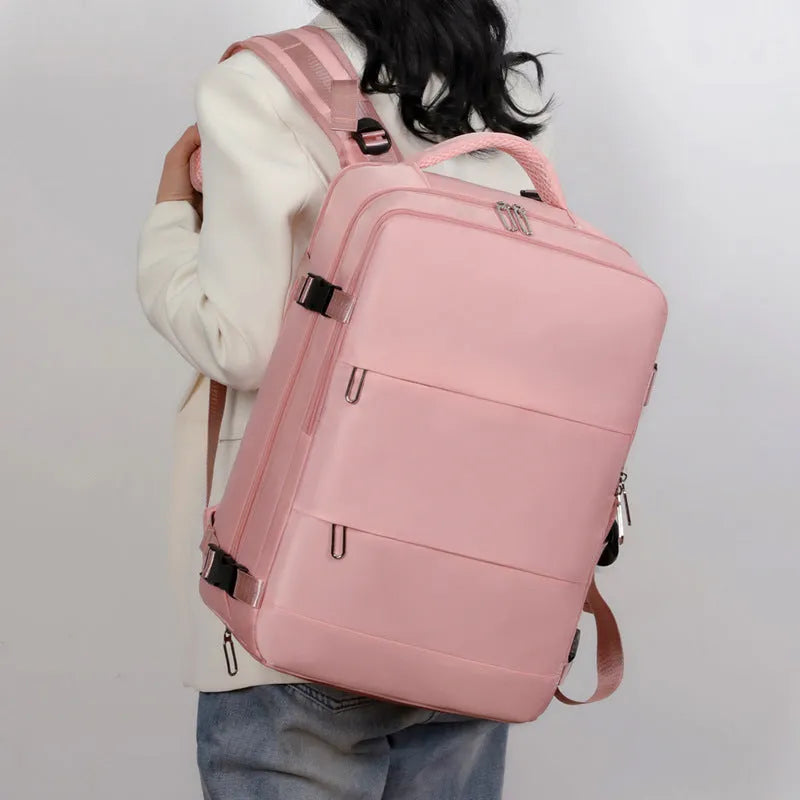 Large capacity travel backpack in purple with multiple compartments and air pillow belt system