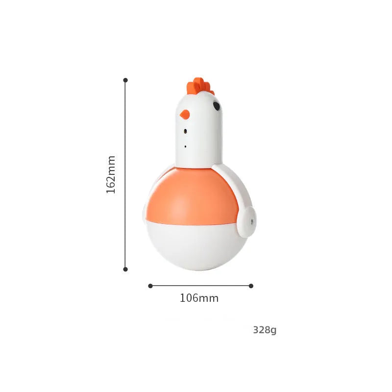 Green and orange electric cat toy chicken with laser and sound features on a flat surface.