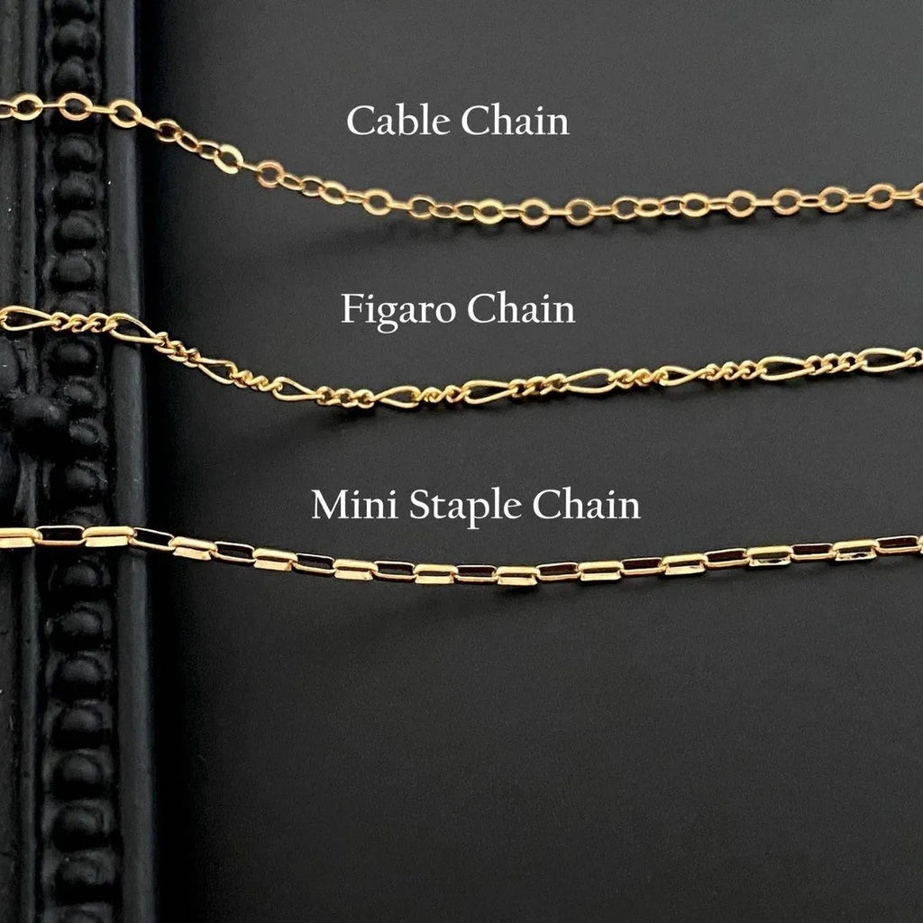 Ghost pendant necklace on a stainless steel chain with choice of cable, Figaro, or mini staple style.