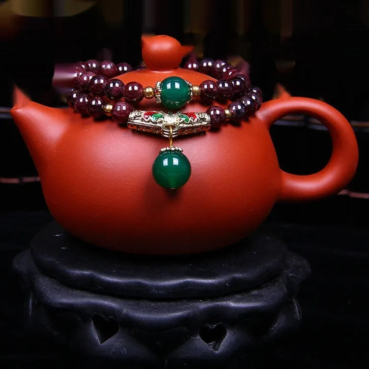 Natural garnet bracelet with 7mm beads, double ring closure and golden toad charm