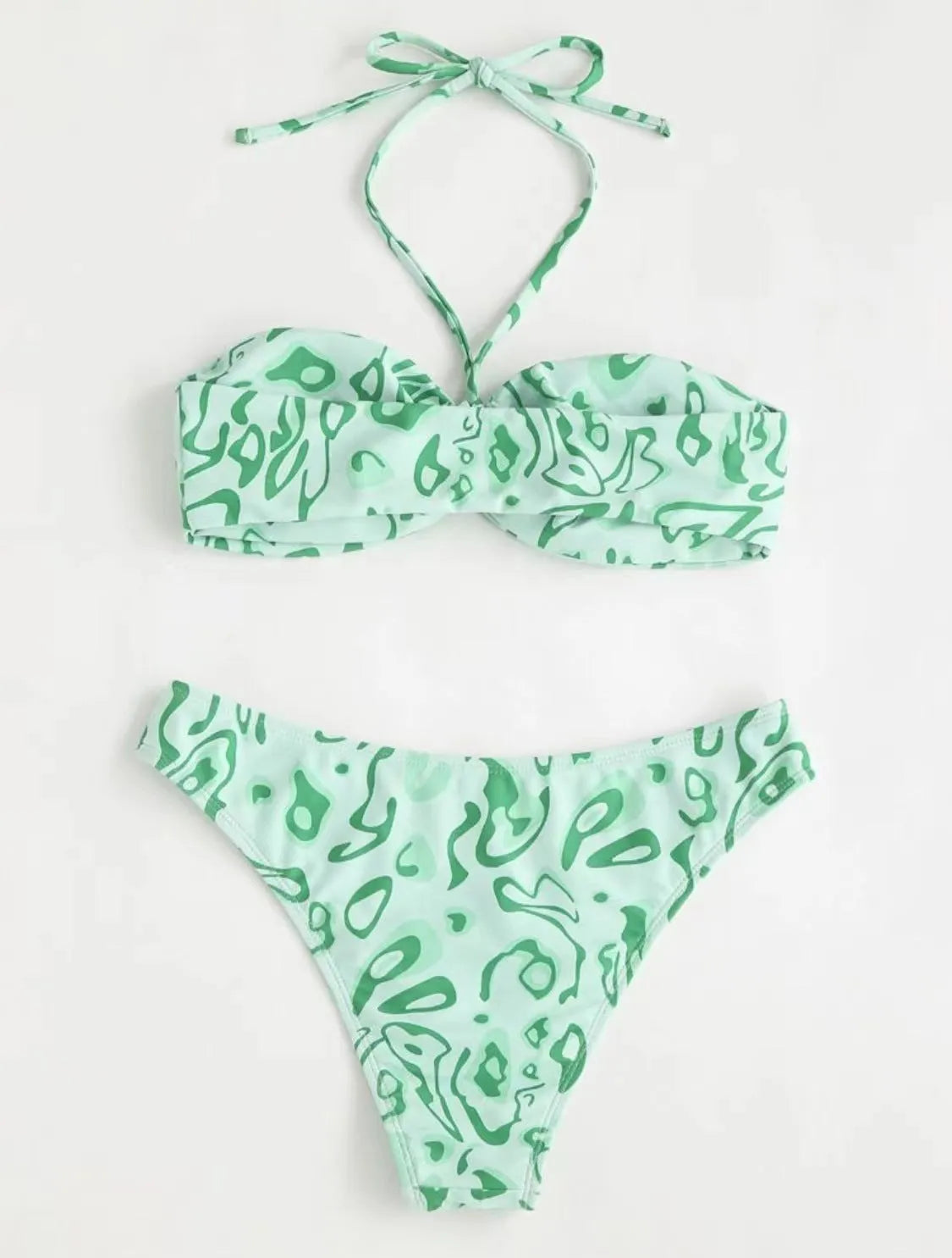 Green floral bandeau bikini swimsuit with split style bottom and backless design on mannequin