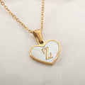 Heart-shaped letter necklace with white shell detail on gold-plated stainless steel chain