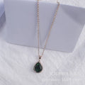 Rose gold water drop necklace with geometric rhinestone pattern in pink colour