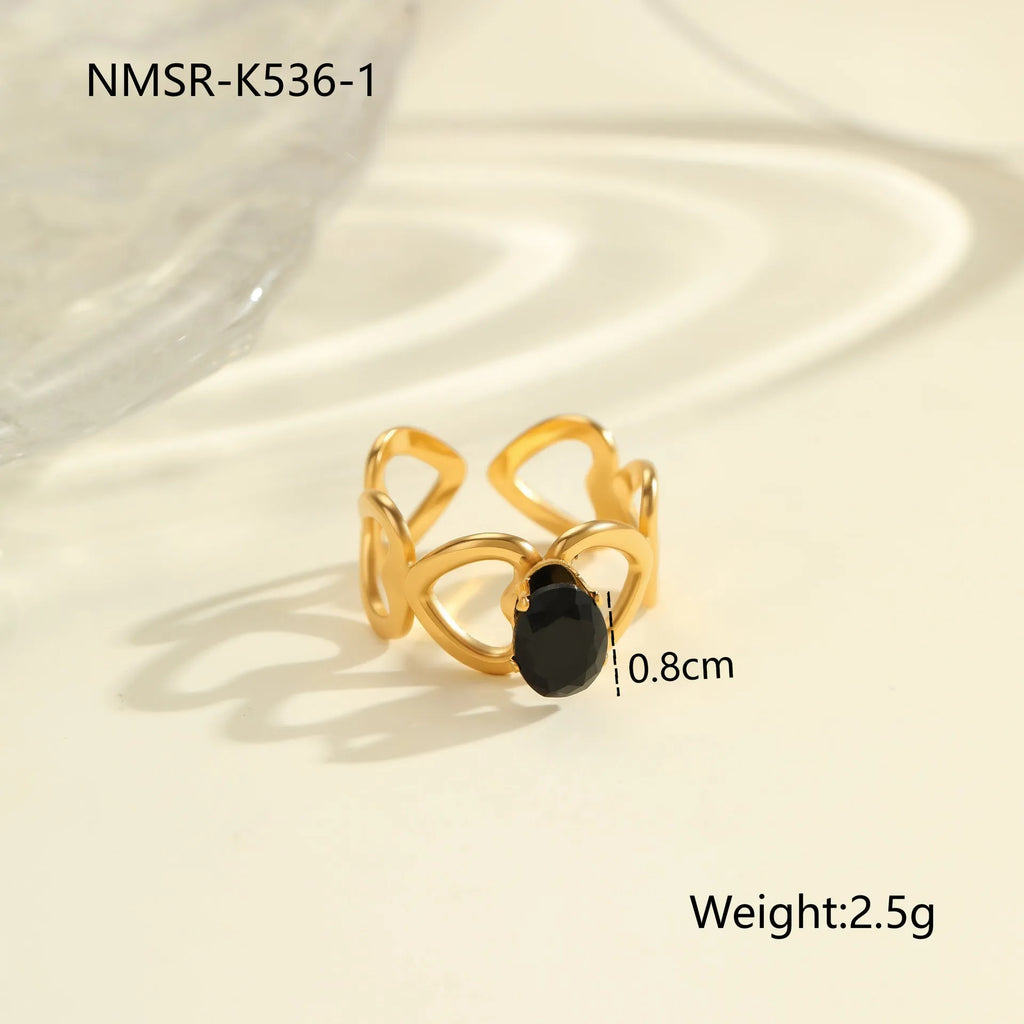 Geometric open mouth women's ring in titanium steel with inlaid zircon stones and electroplated finish.