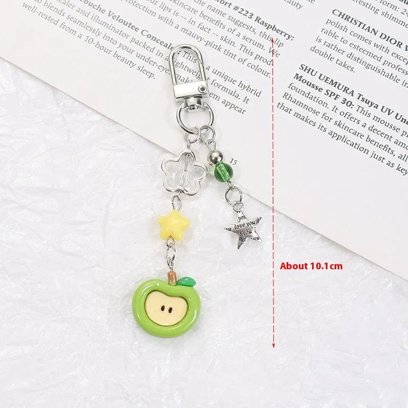 Cute fruit design plastic phone charm keychain on a white or silver rope.