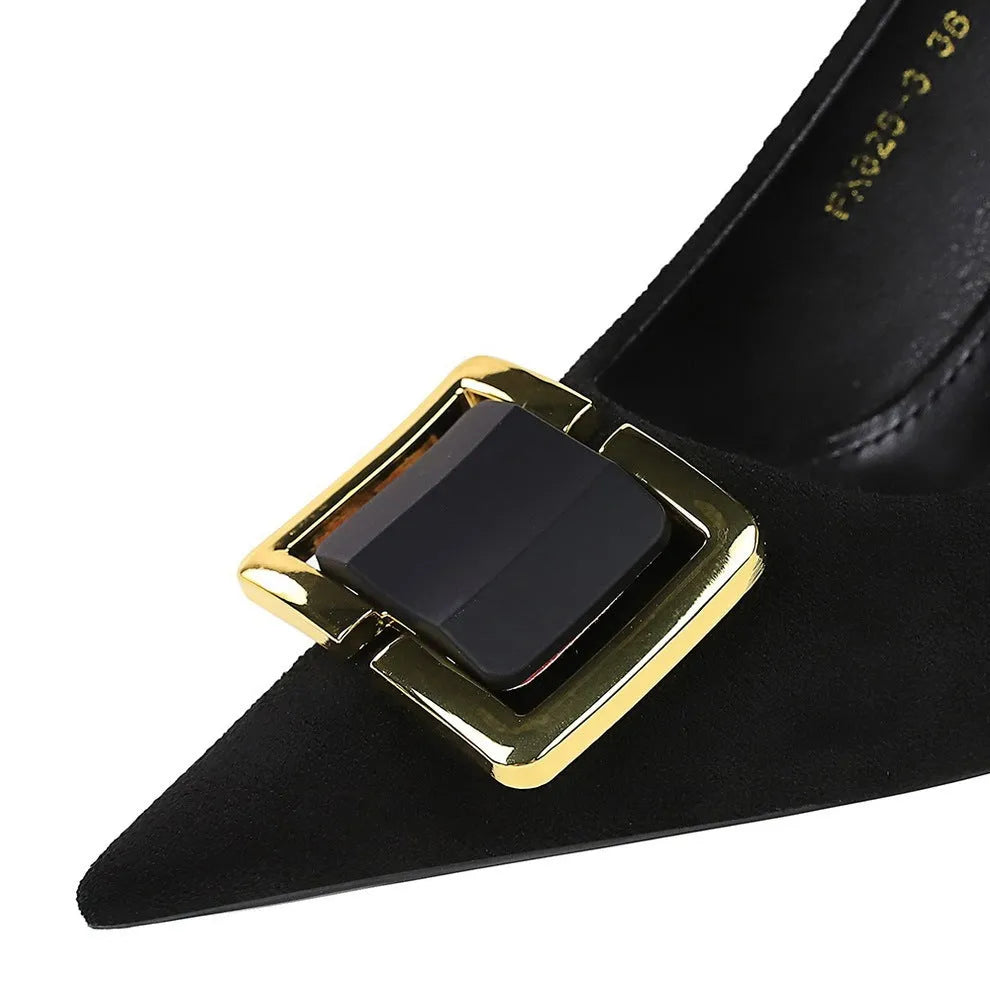 Black suede women's stiletto high heels with a pointed toe and 9cm heel on a rubber sole.