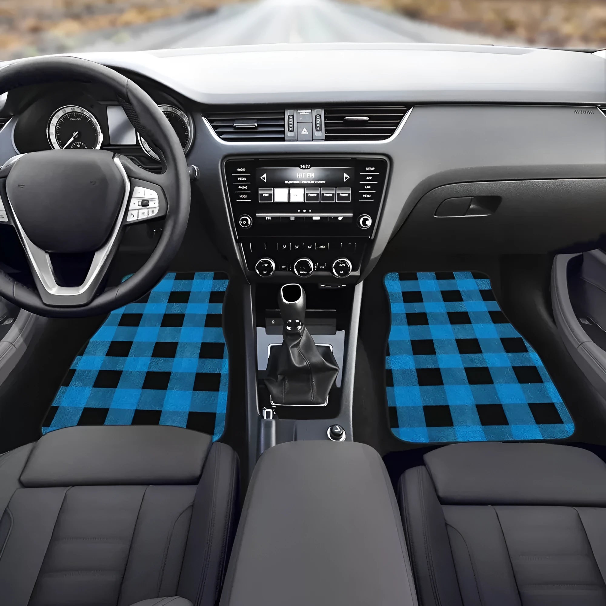 Black four-piece rubber car foot mat set with a textured surface.