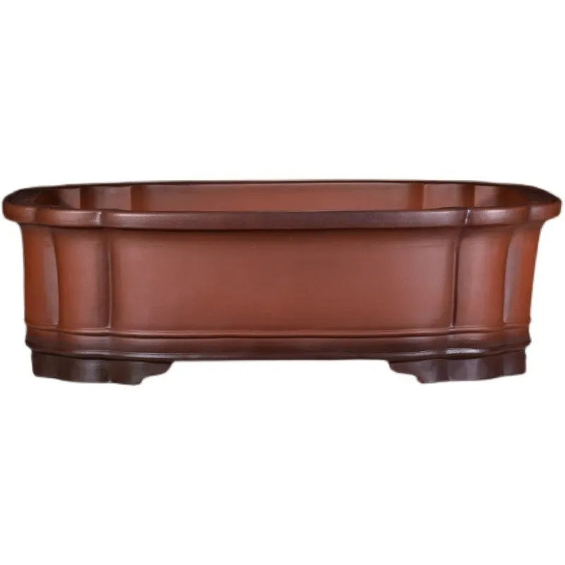 Large oval antique-finish purple clay flowerpot with carved crabapple tree design.