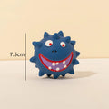 Set of four colourful natural latex rubber dog balls with cute faces and bumpy texture
