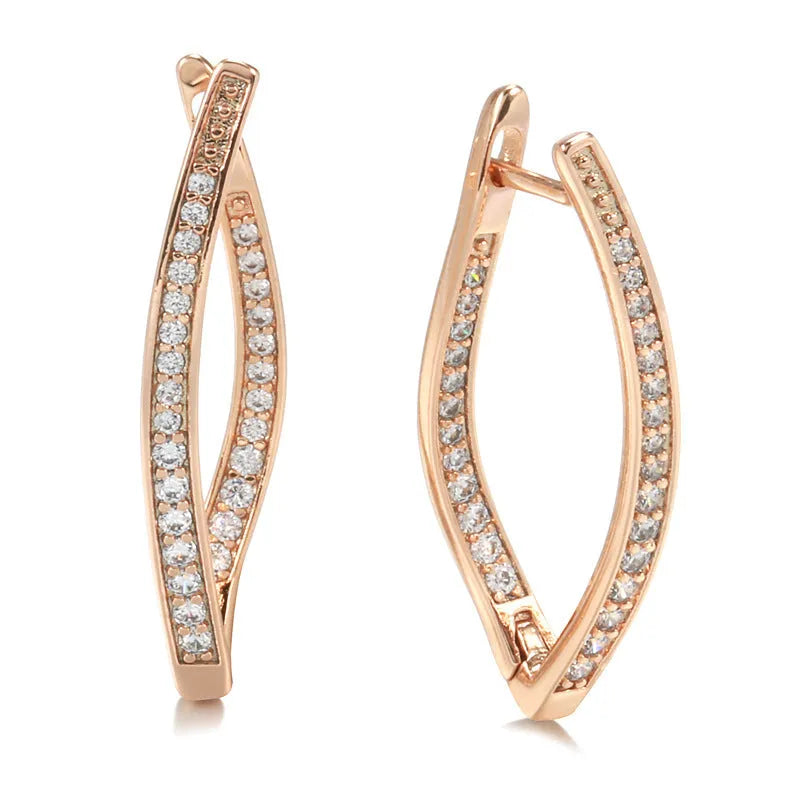 A pair of geometric drop earrings with a clear zircon stone and copper posts, colour H0493.