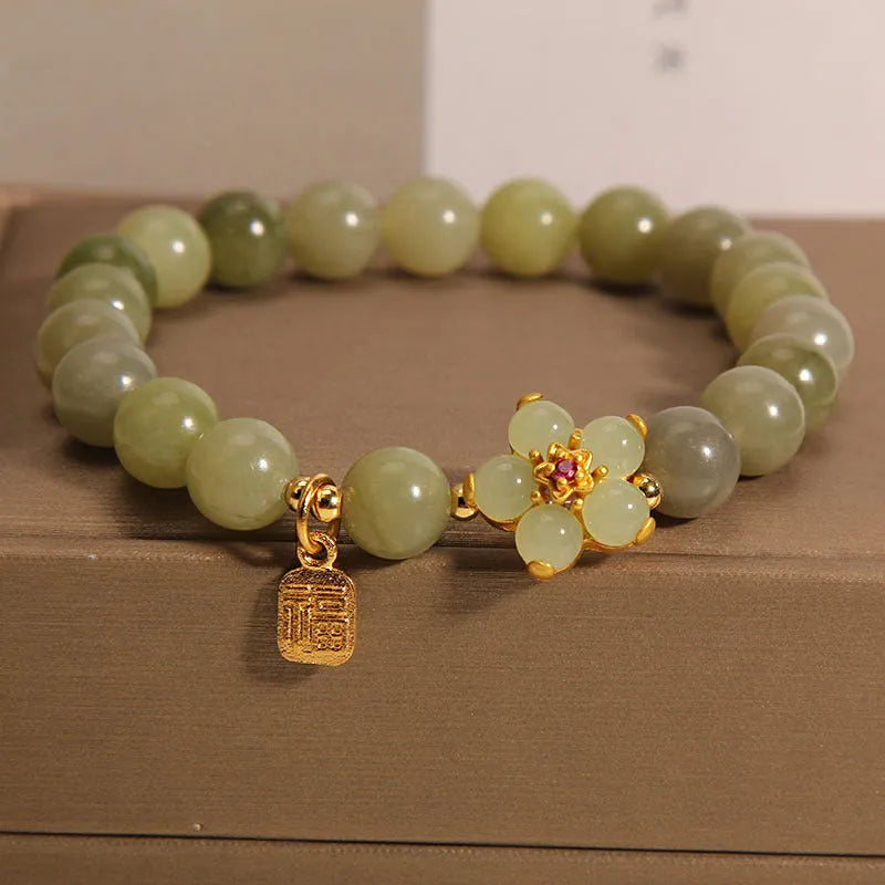 A grey jade coloured alloy bracelet for women in a casual style.