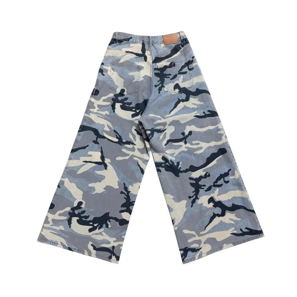Snow camouflage blue loose-fit denim jeans on a mid-waist mannequin, showing the trousers length and camouflage pattern.
