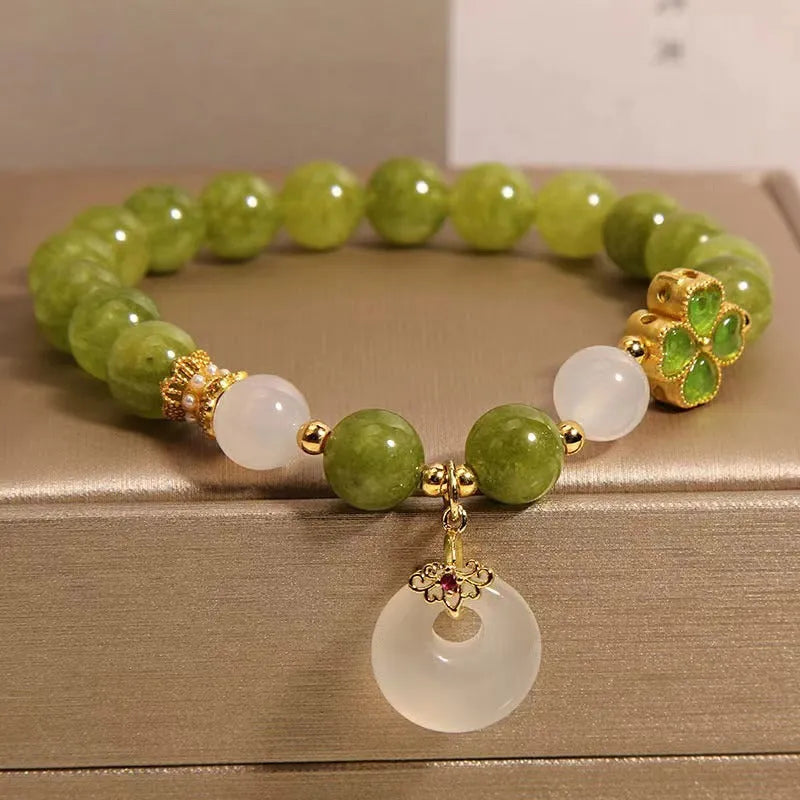 Women's green tourmaline bracelet with a four-leaf clover safety buckle in New Chinese style.