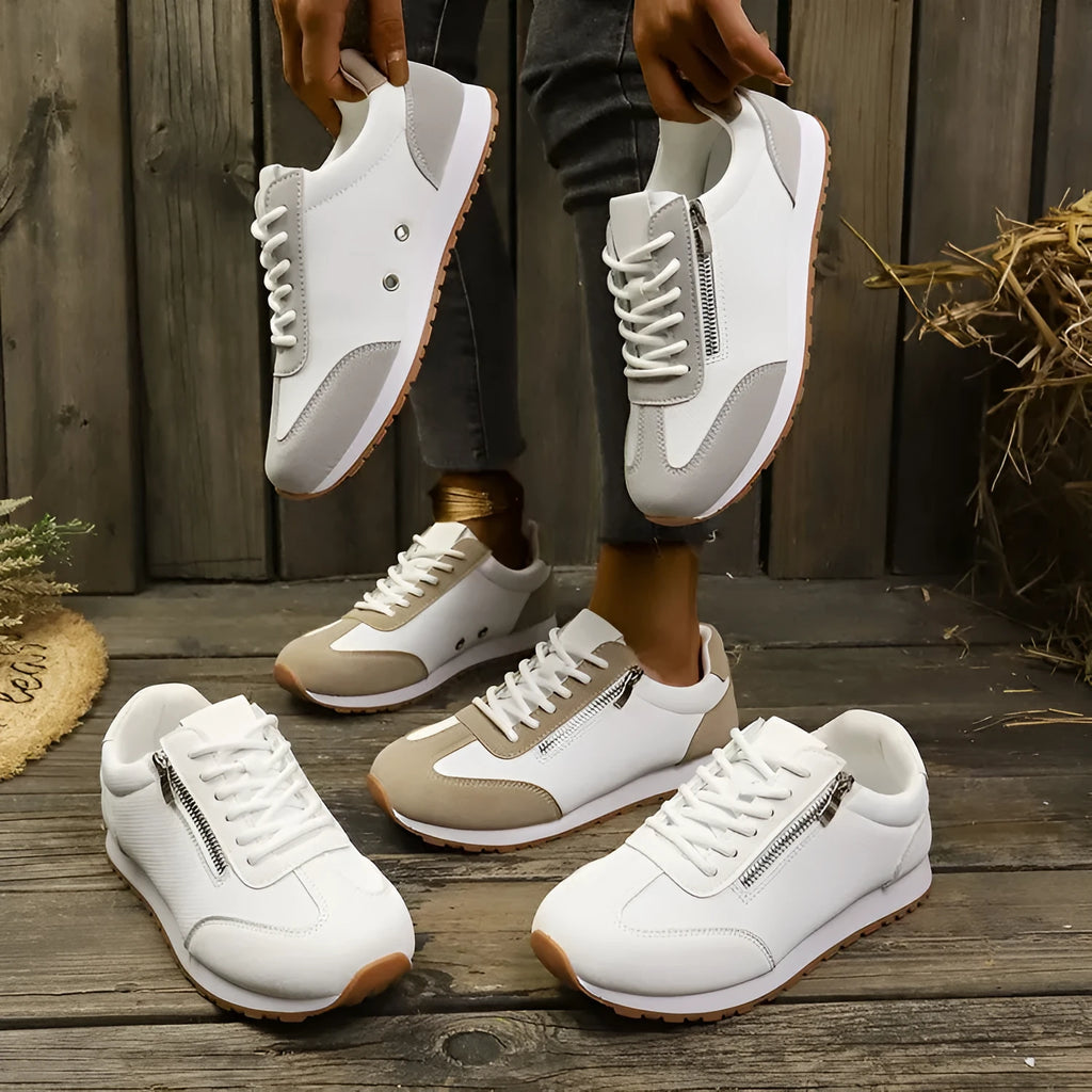 Women's flat-heeled shoes in grey, white, and champagne with rubber sole and PU upper.