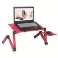 Black folding computer desk with adjustable strap and cooling holes for laptop ventilation